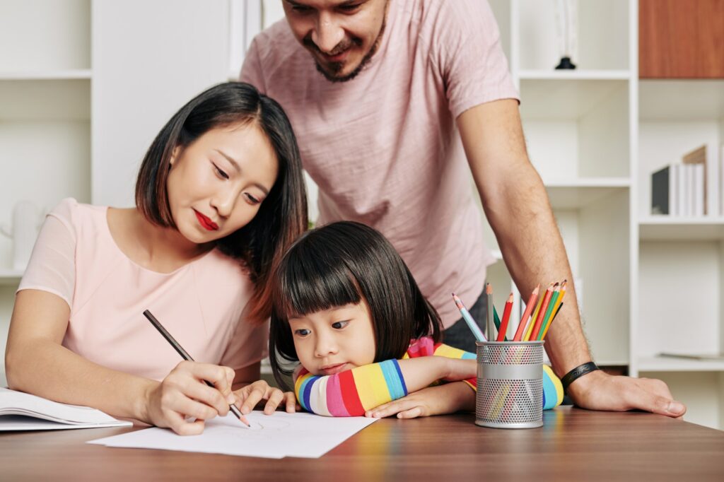 parents teaching daughter